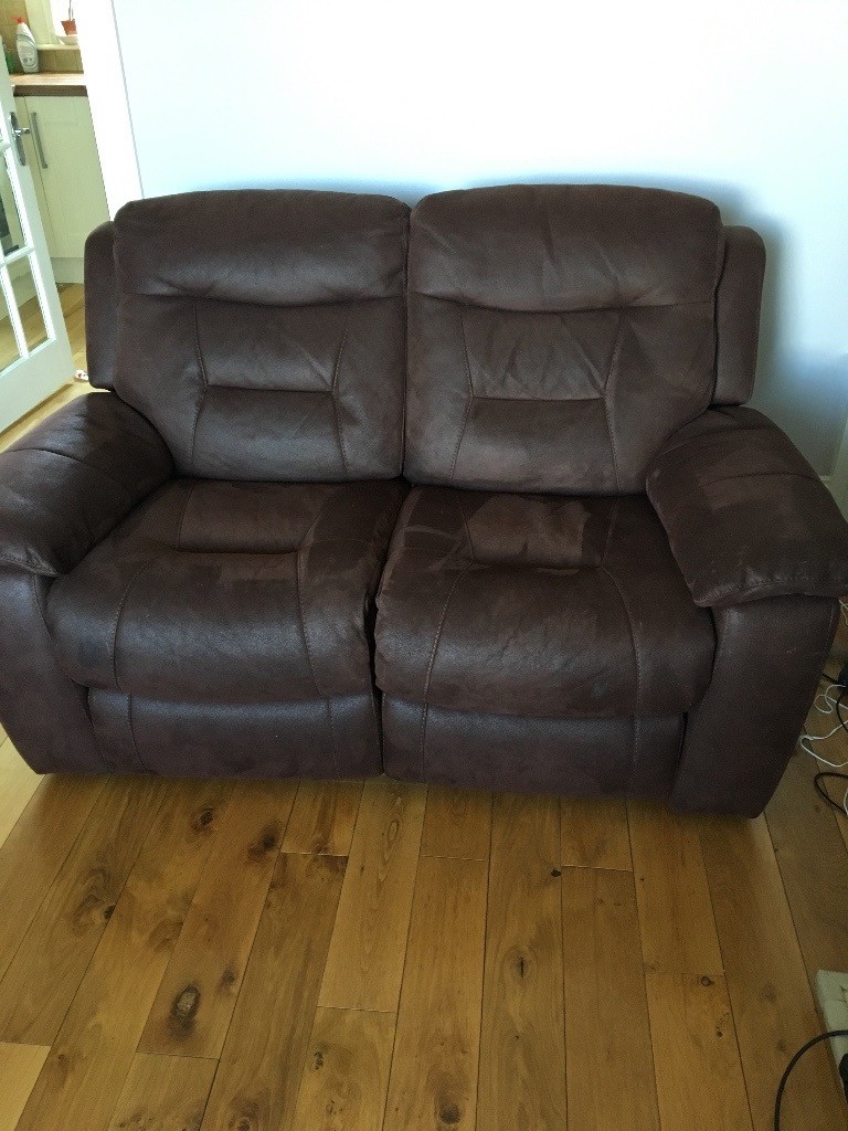 Two 2 seater faux leather brown electric recliner sofas in Selkirk