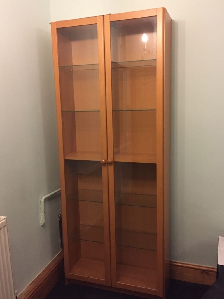 Ikea Tall Billy Bookcase with Glass Doors and glass shelves in