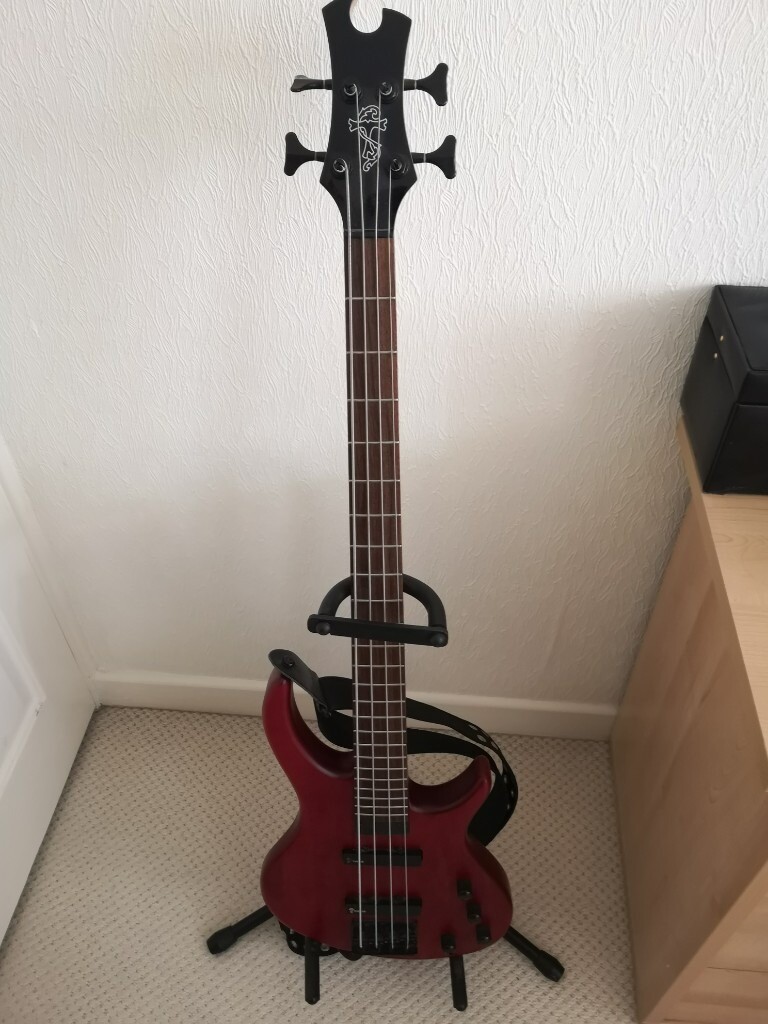 Bass Guitar for sale, strap and stand included. Hardly used. in