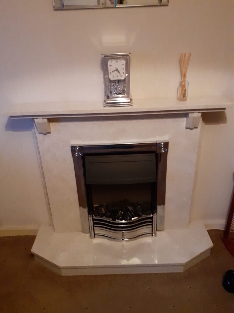 Marble fire surround and hearth with electric fire in Dalry, North