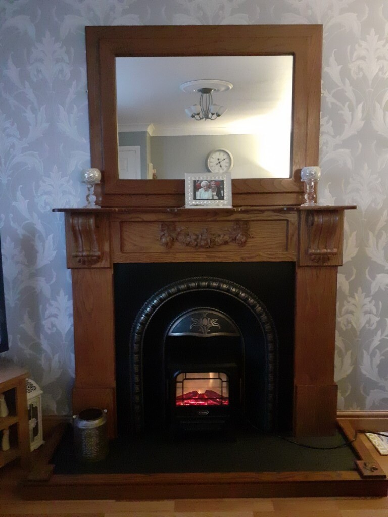 Fireplace and surround along with electric stove fire and harth