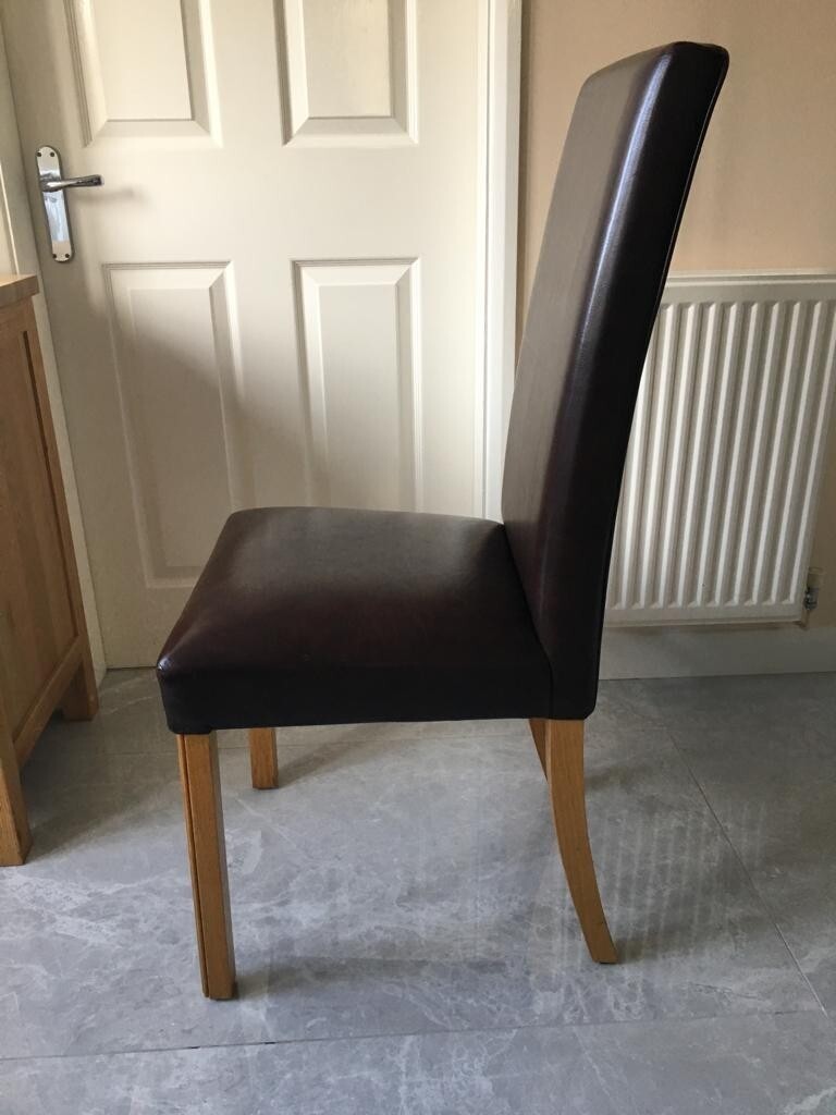Marks & Spencers dark brown leather dining chairs. in Loughborough