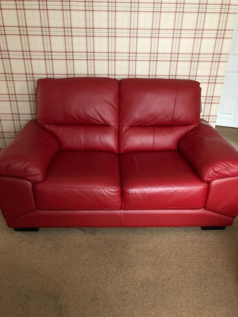 Harveys red leather sofa. In immaculate condition, only a year old