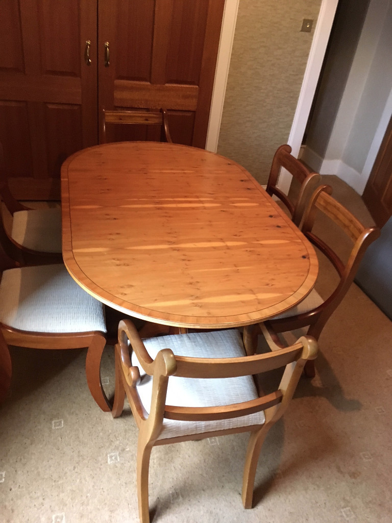 Yew Dining Room Table, 2 Carvers, 4 Dining Room Chairs and Sideboard
