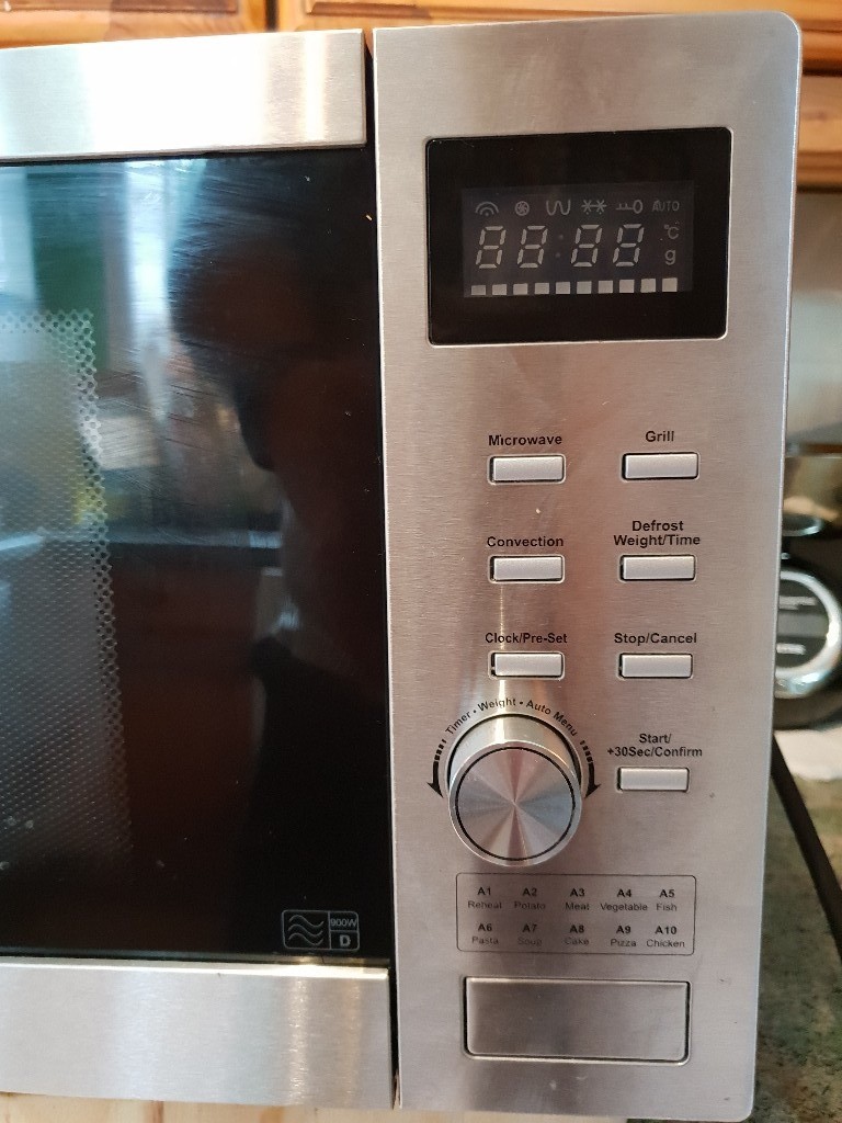 De Longhi stainless steel combination microwave in Farsley, West