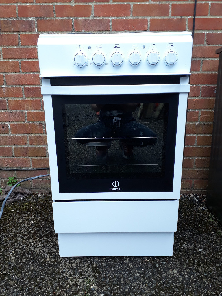 As new freestanding Indesit electric 4 hob oven in Christchurch