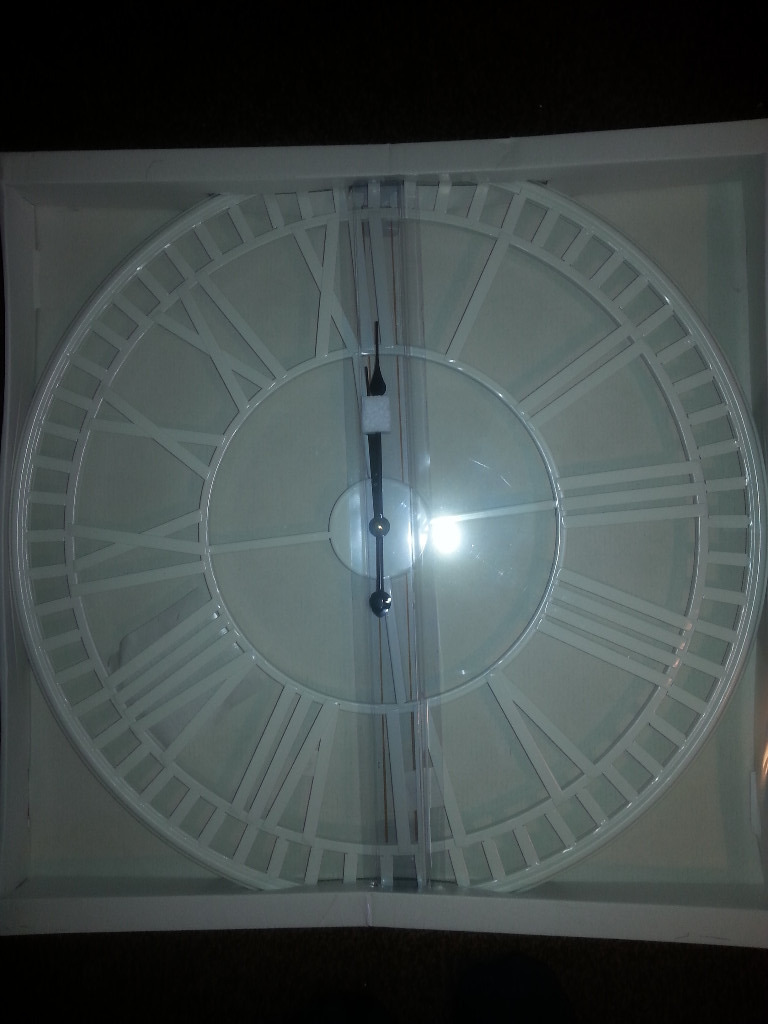 Unopened large white metal skeleton wall clock 60cm in Woking, Surrey
