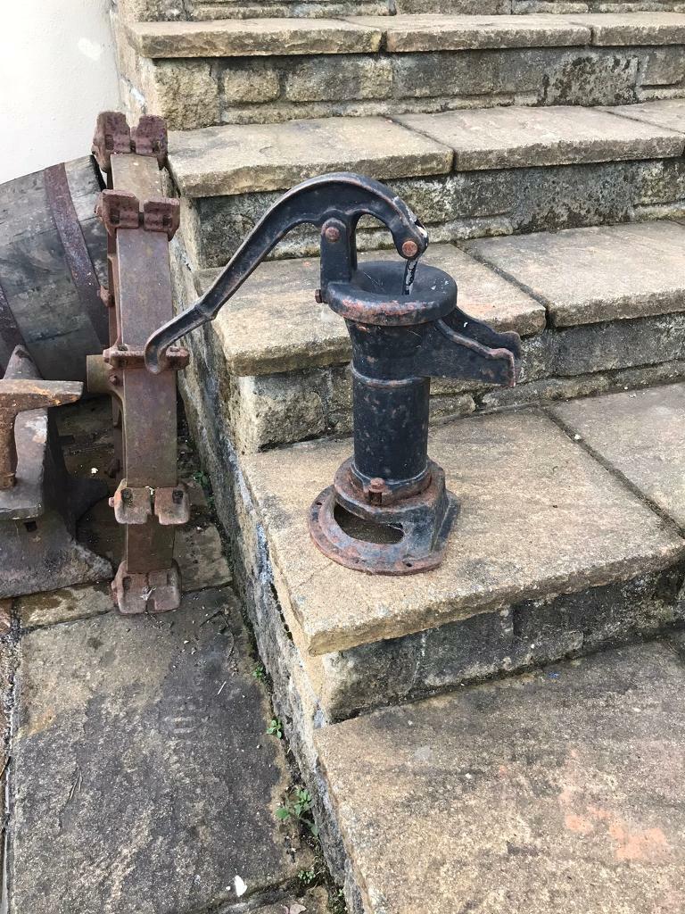 Antique cast iron water pump garden pond ornament in Bodmin, Cornwall
