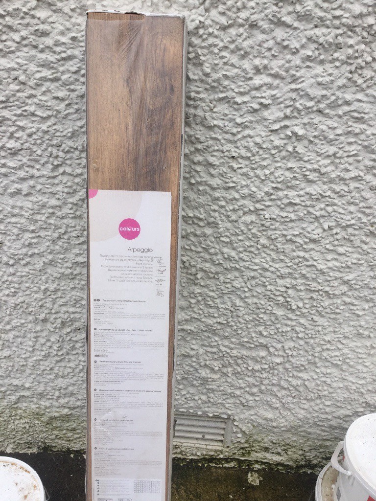 One full box and 3 full loose boards of laminate flooring in