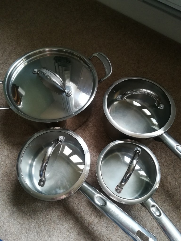 Set of 4 Stainless Steel Pans excellent condition, all with lids