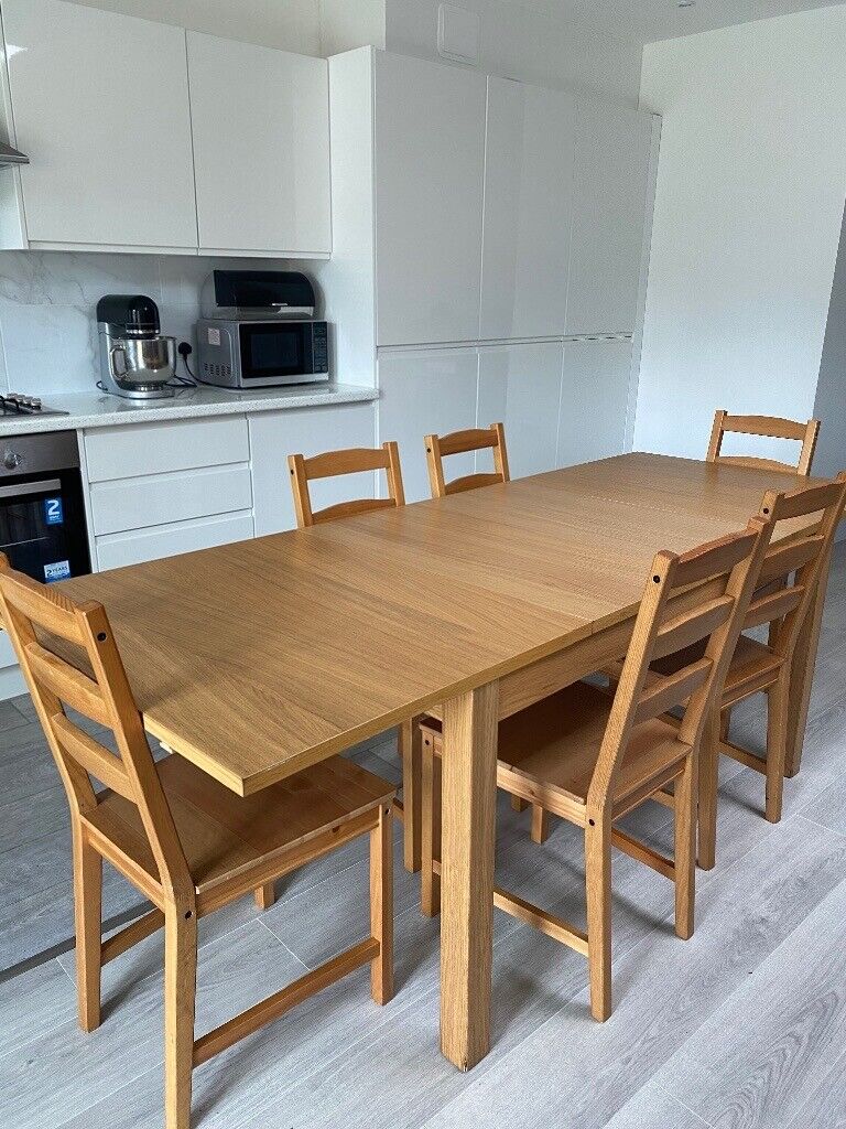 Wooden IKEA Dining table and 6 chairs (extendable) | in Luton