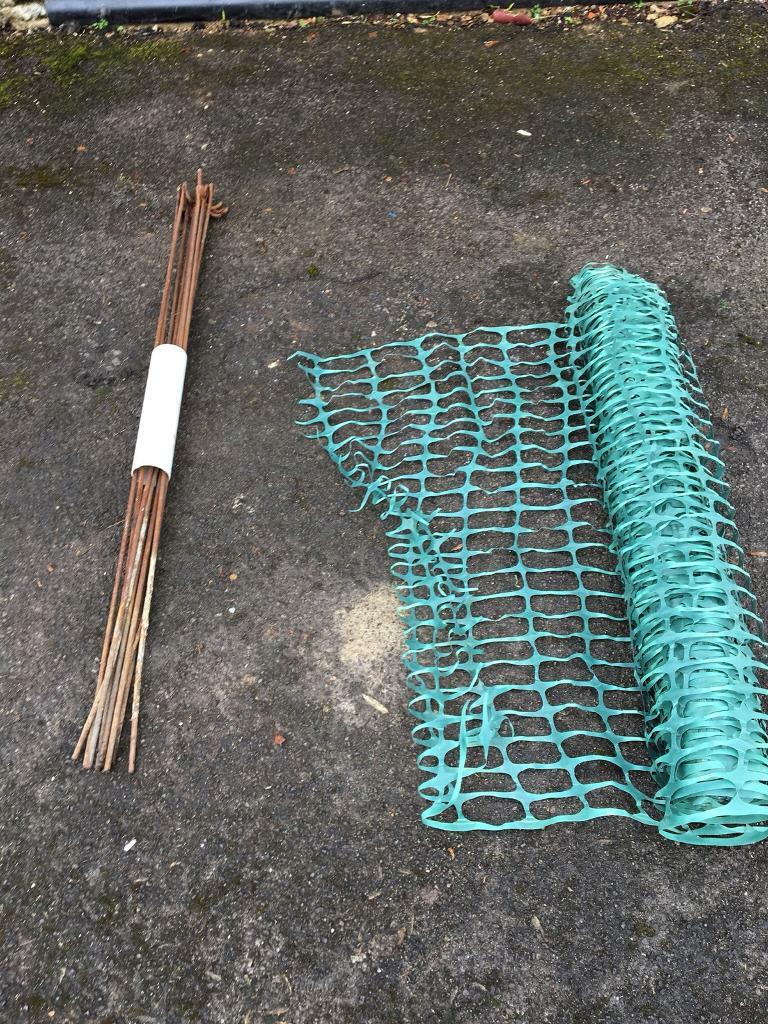 Plastic mesh barrier fencing with stakes in Headington, Oxfordshire