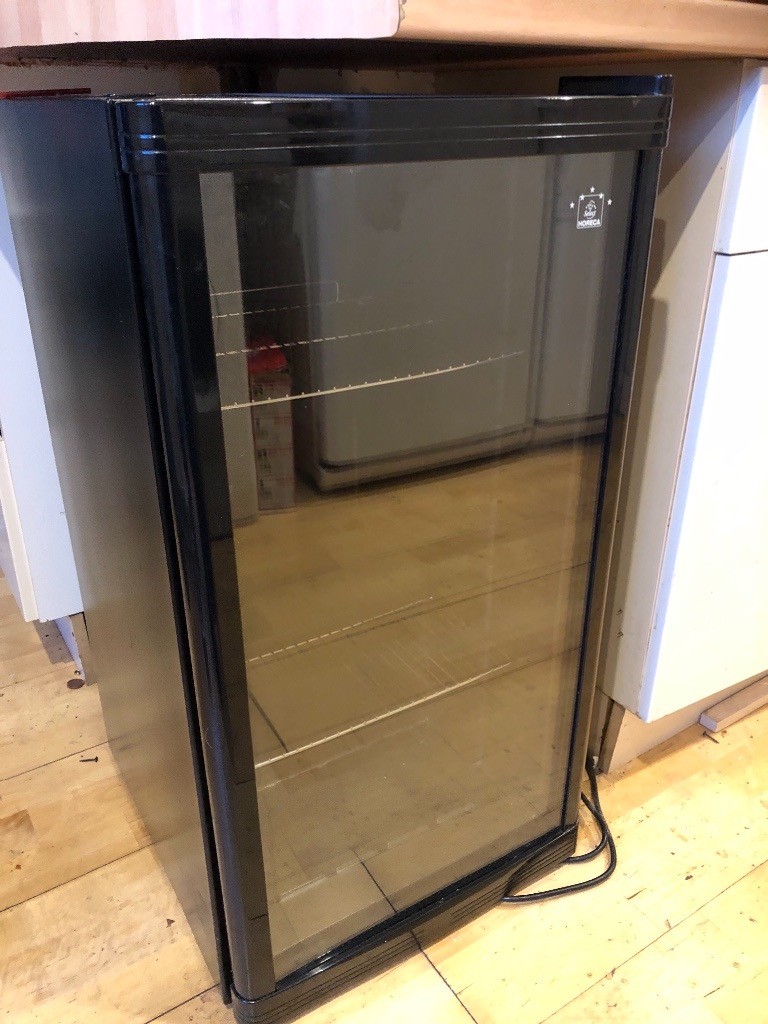 Wine cooler with glass door