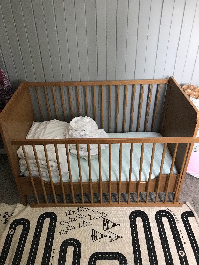 Ikea cot bed with foam mattress and bedding bundle in Dunblane