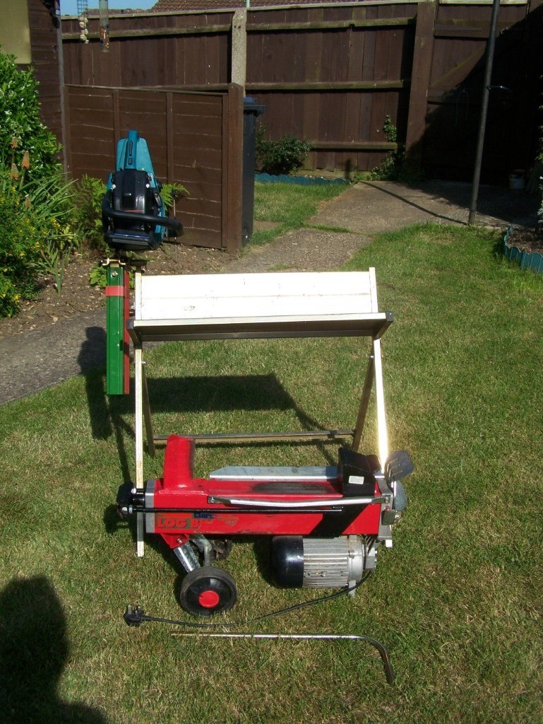 Log Splitter Chainsaw And Cutting Bench In