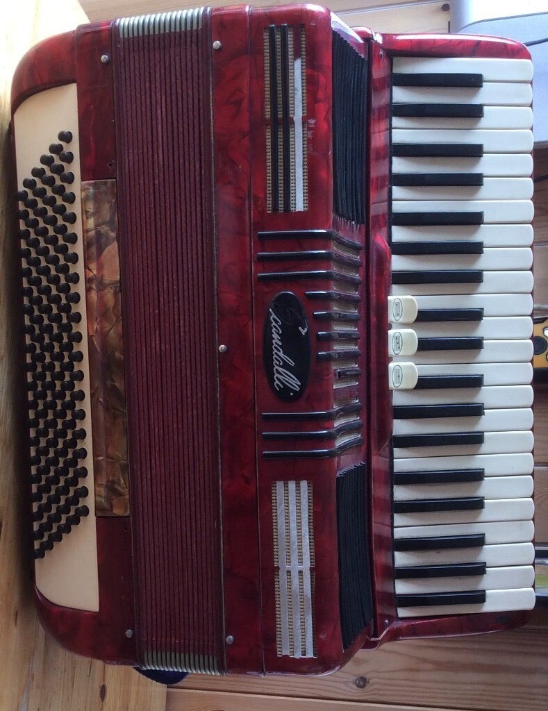 Scandalli piano accordion with 120 bass. Colour red. Condition used