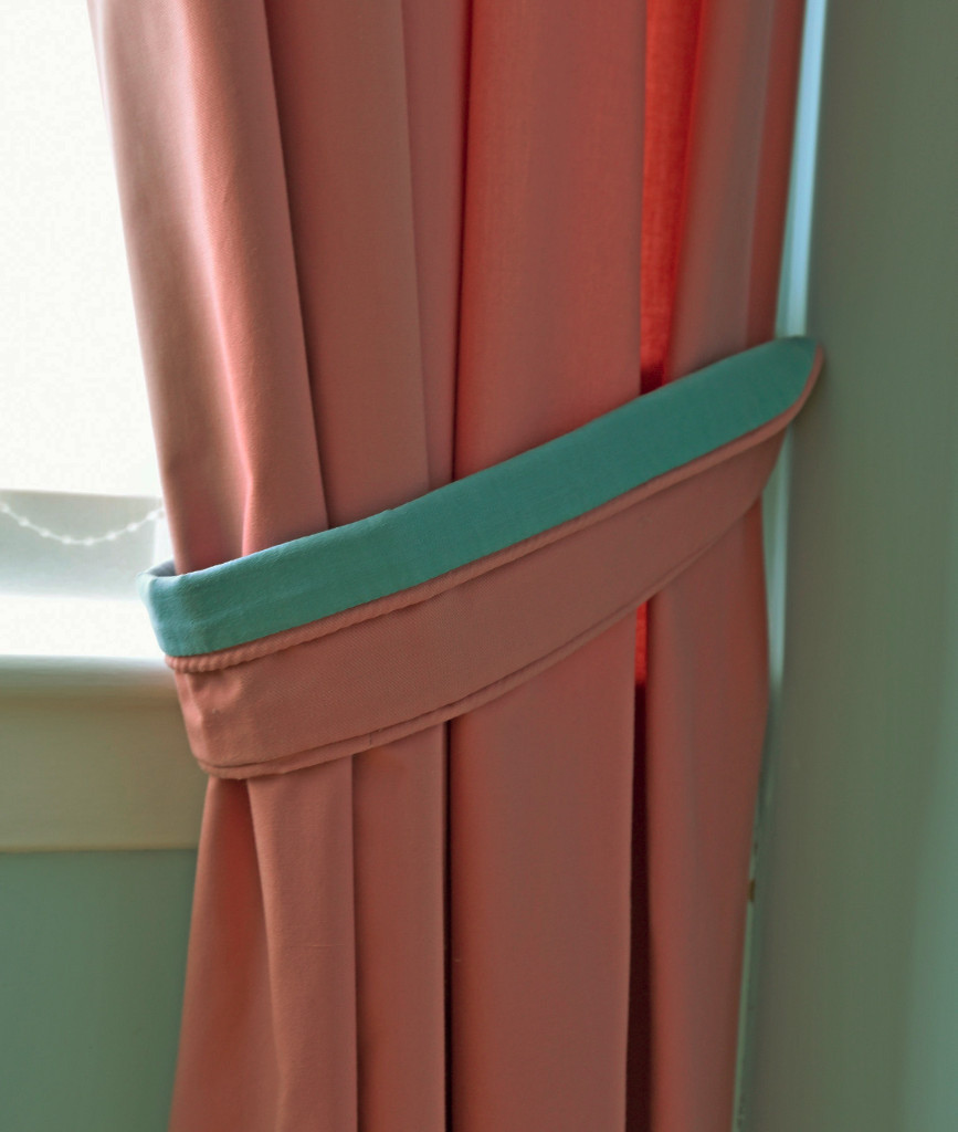One pair of fully lined, pinch pleat lounge curtains with tiebacks