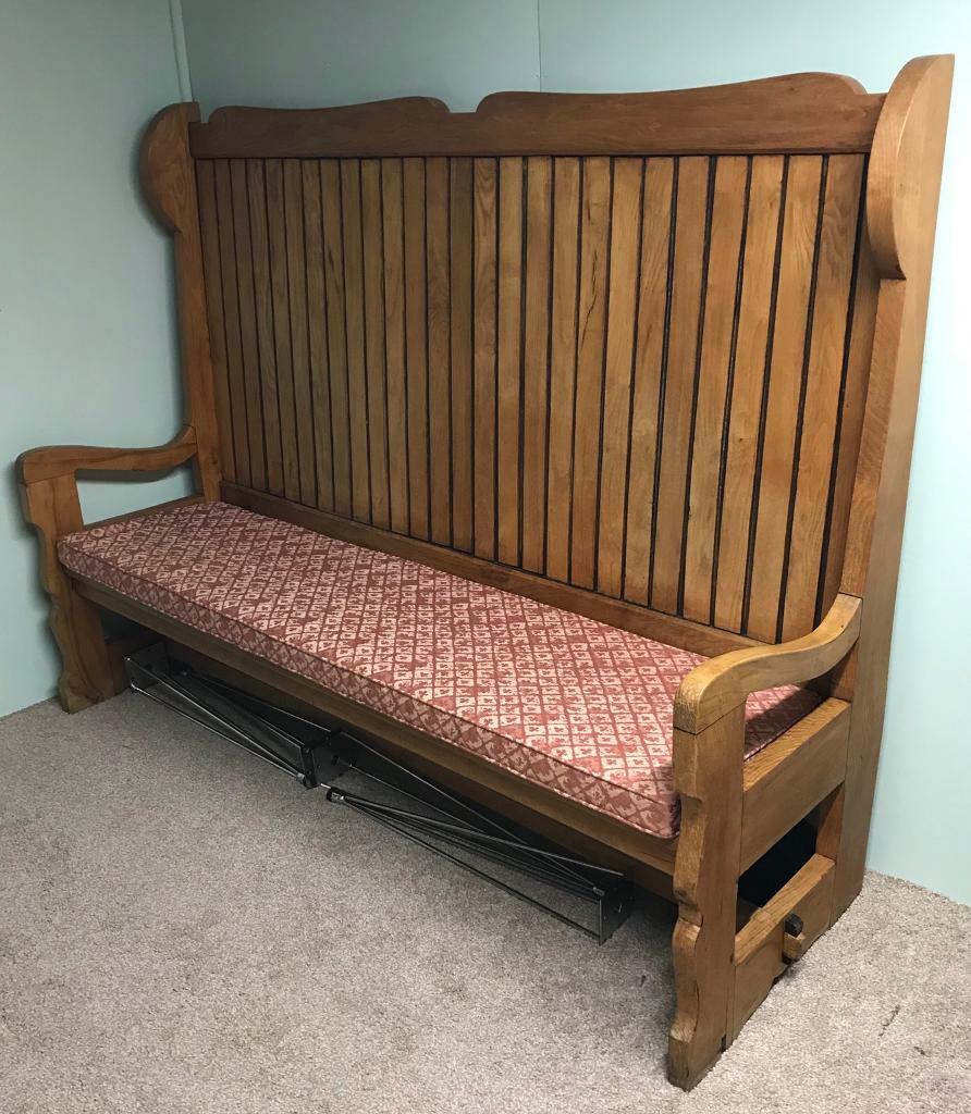 Large solid oak tavern settle bench with original cushion, mid century