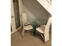 Designer glass dining table and 4 chairs