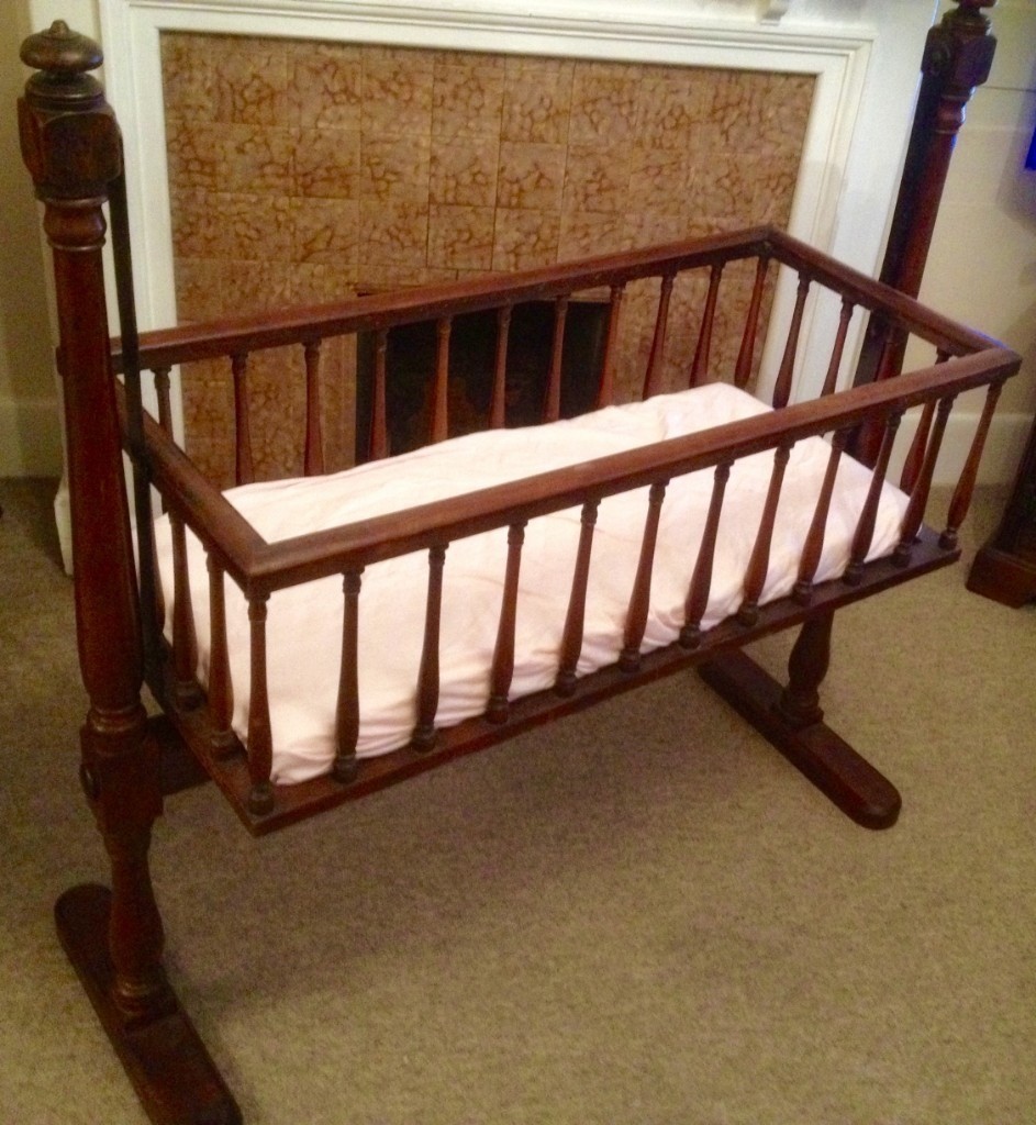 Antique wooden rocking crib in excellent condition with new unused