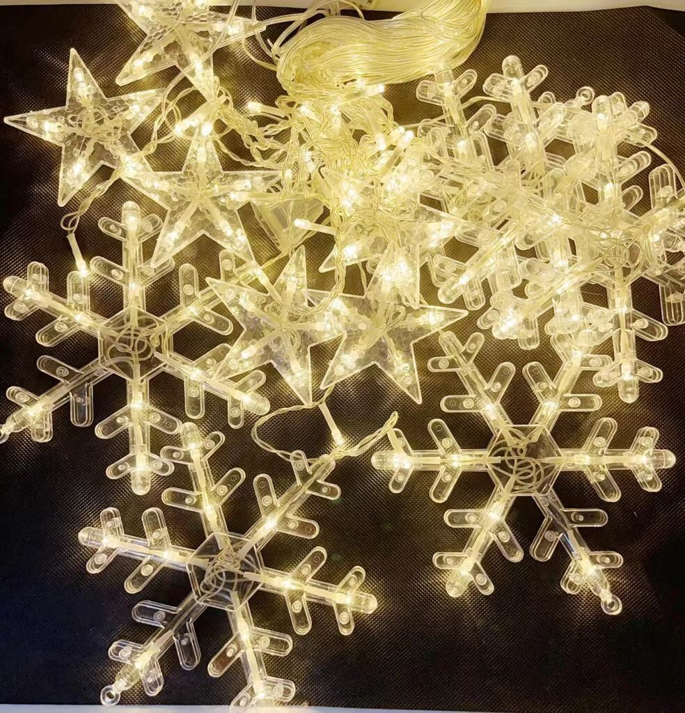 Luci di Natale Tenda Luminosa 12 Stelle Fiocchi Neve LED Luce Bianco Caldo reb