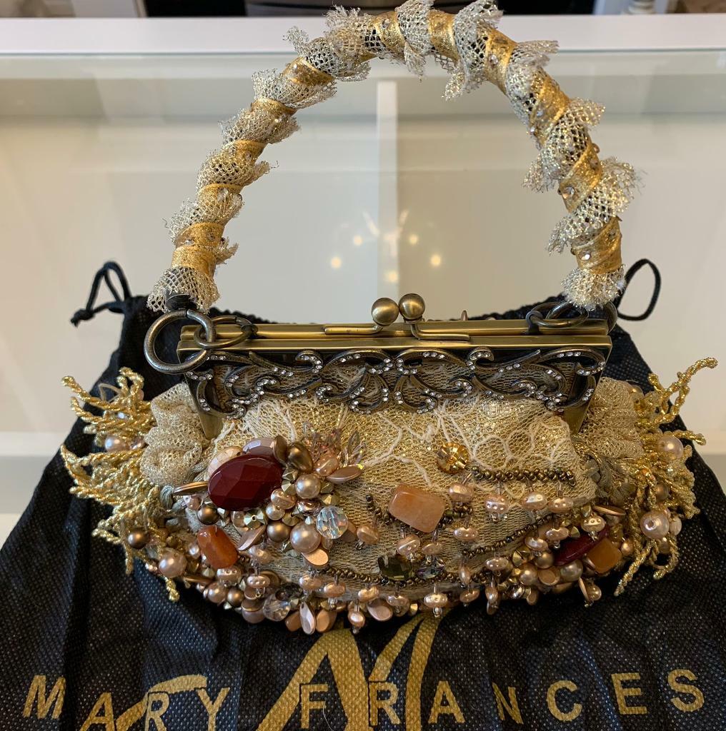 gold embellished bolsa