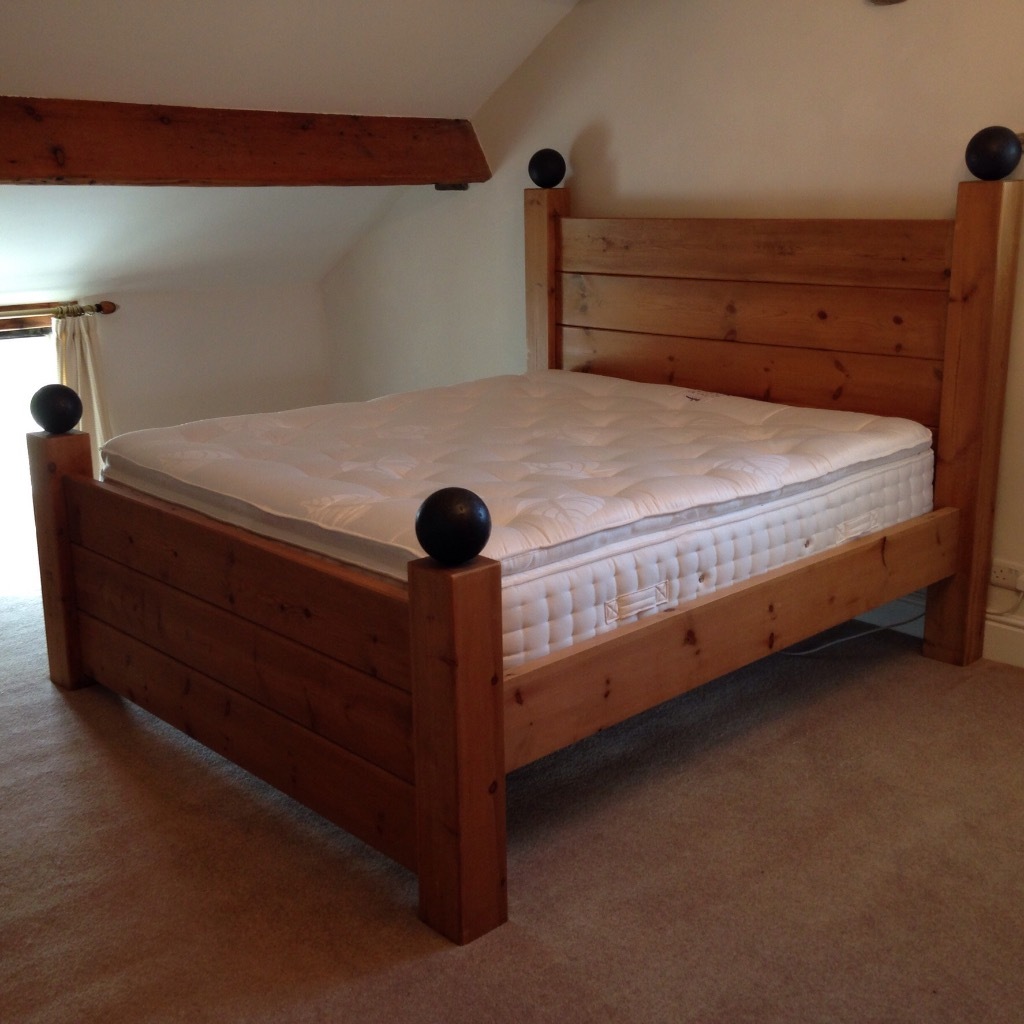 Super King Size feature bed. Heavy pine wood construction with 4 cannon