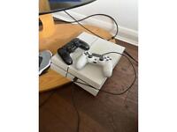 White PS4 with 3 controllers