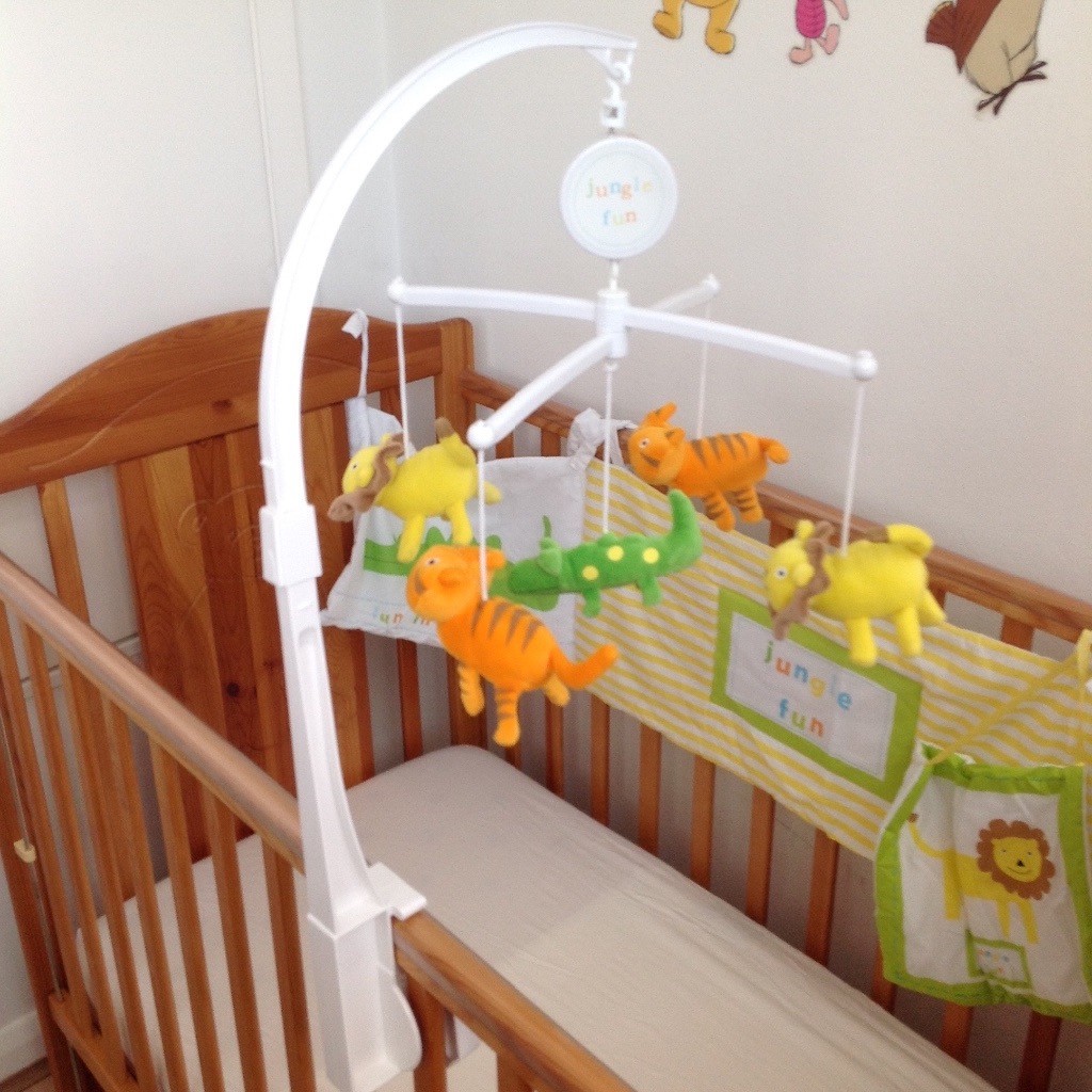 Wooden baby cot + free musical mobile cot, bedding and more in Ealing