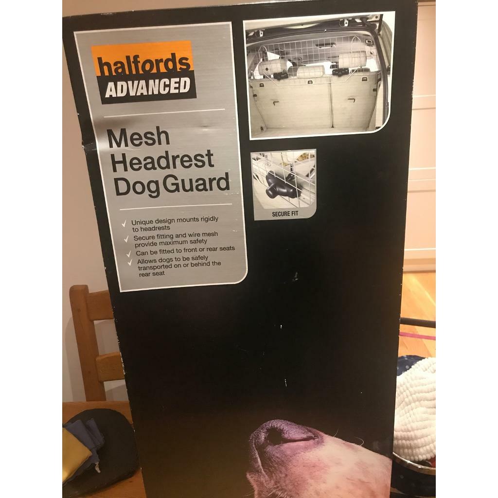 Dog guard. New in box Dog guard mesh headrest dog guard from Halfords