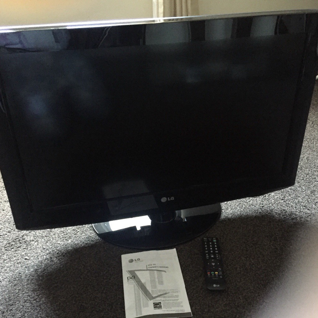 ... Array - 32 inch lg lcd tv on stand with remote control and manuals in rh