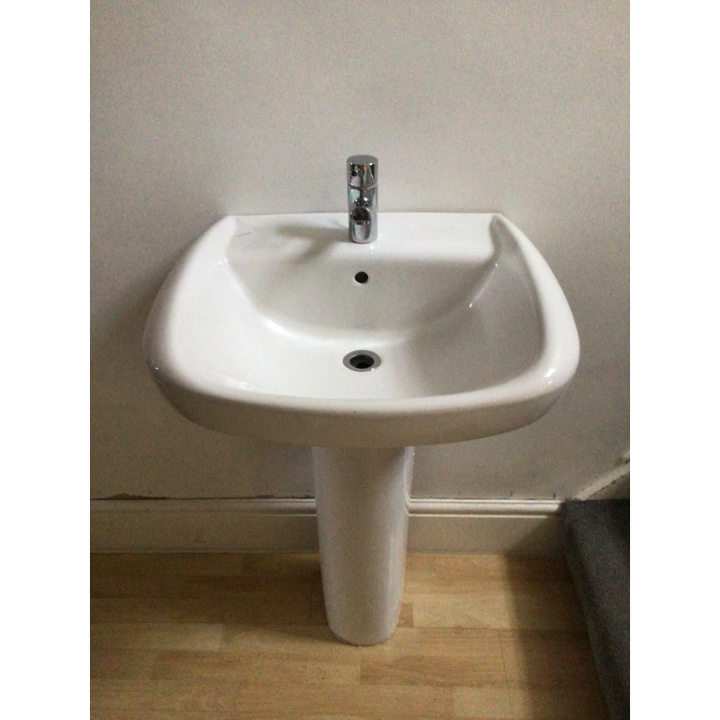 Bathroom basin twyford with pedestal and brass tap shown in Exeter