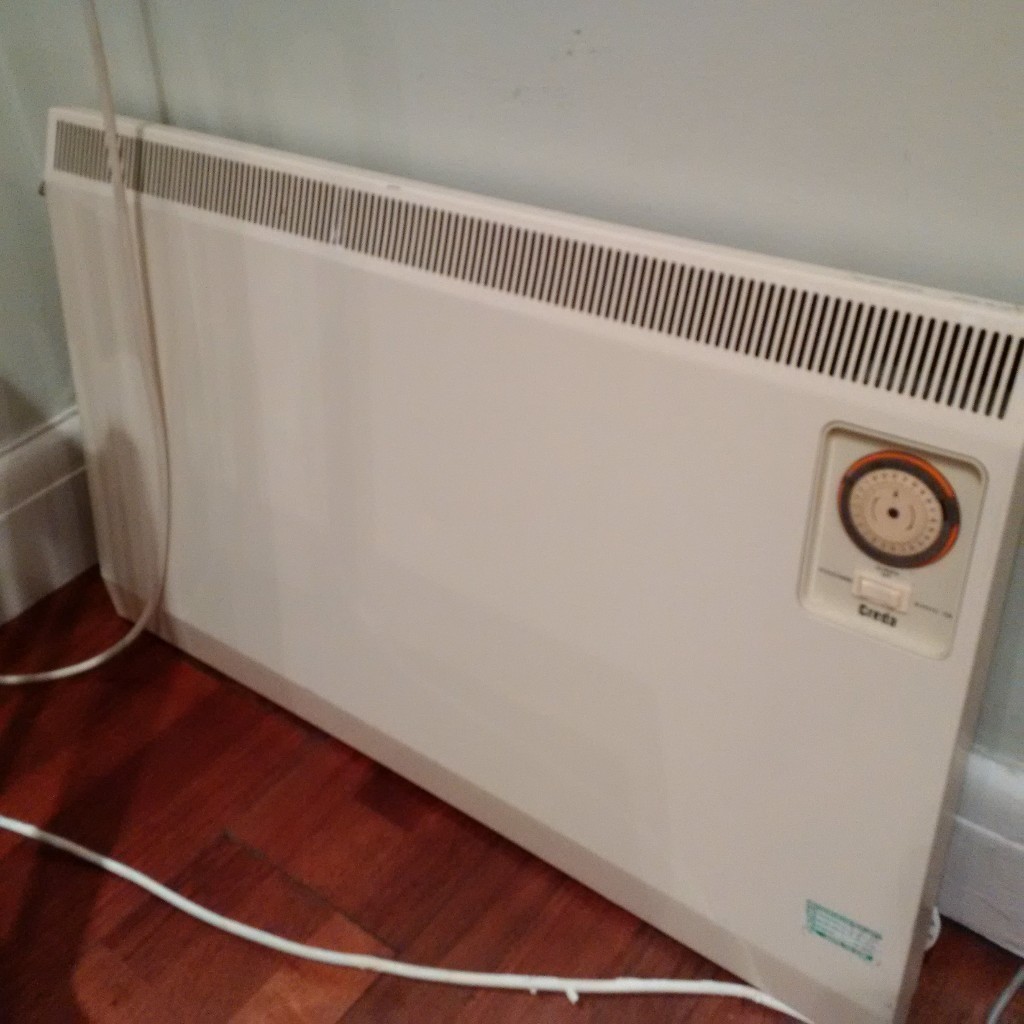 slimline 900W wall mounted panel heater with timer in Willesden Green
