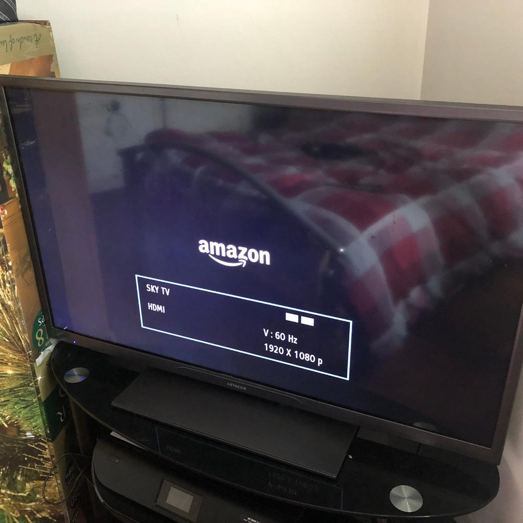 40 inch HD Hitachi Tv and black glass stand in Andersonstown, Belfast