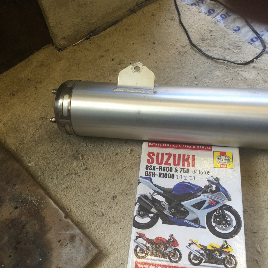 Suzuki GSXR 750 silencer and Haynes manual.