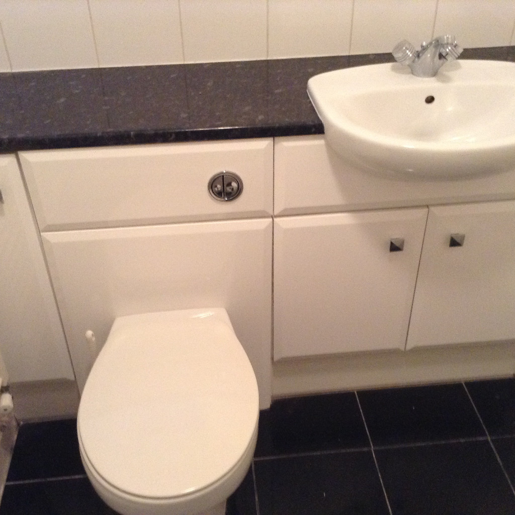 Gloss white vanity sink unit with matching toilet unit. in Newport
