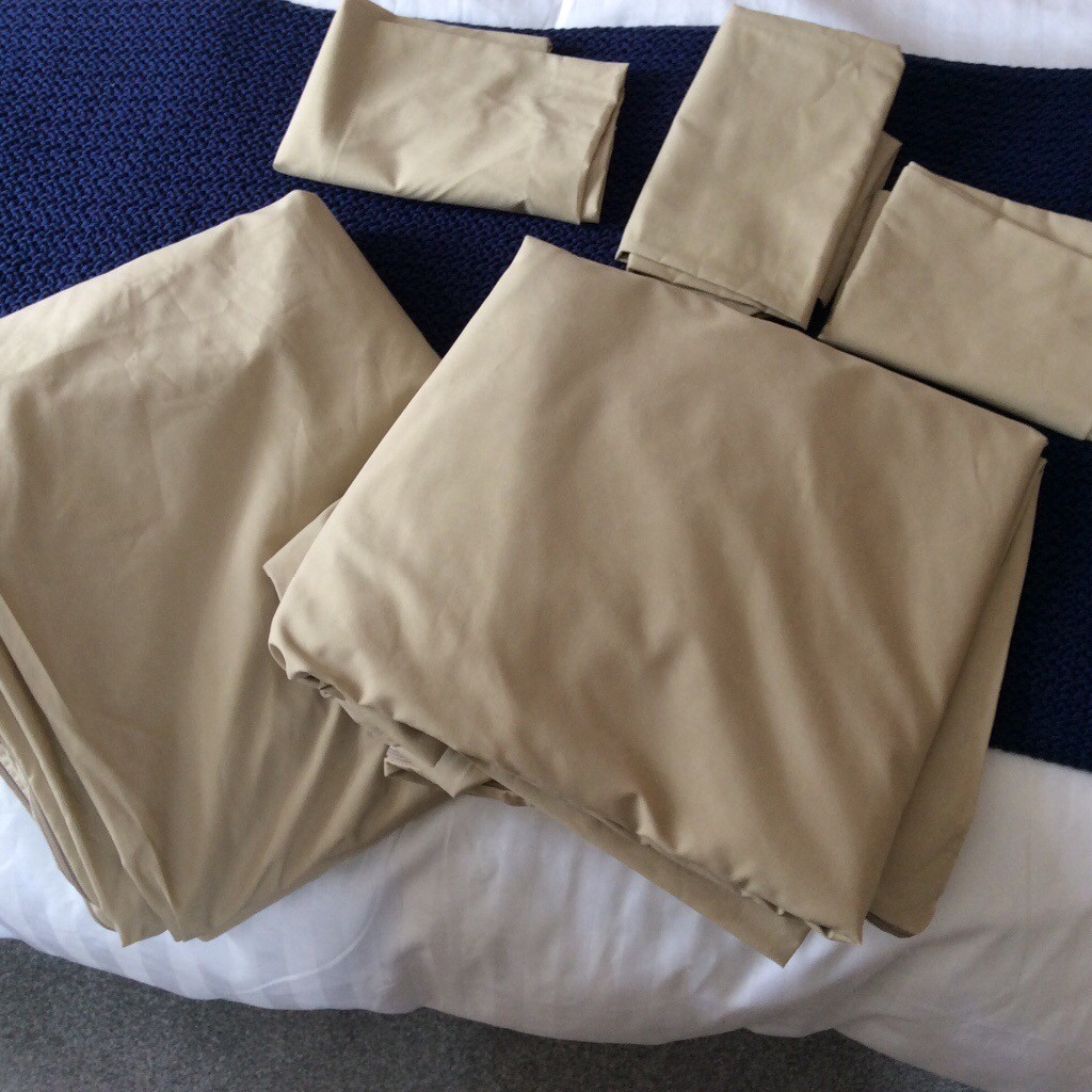 Pair of unused spare duvalay covers with four matching pillowcases in
