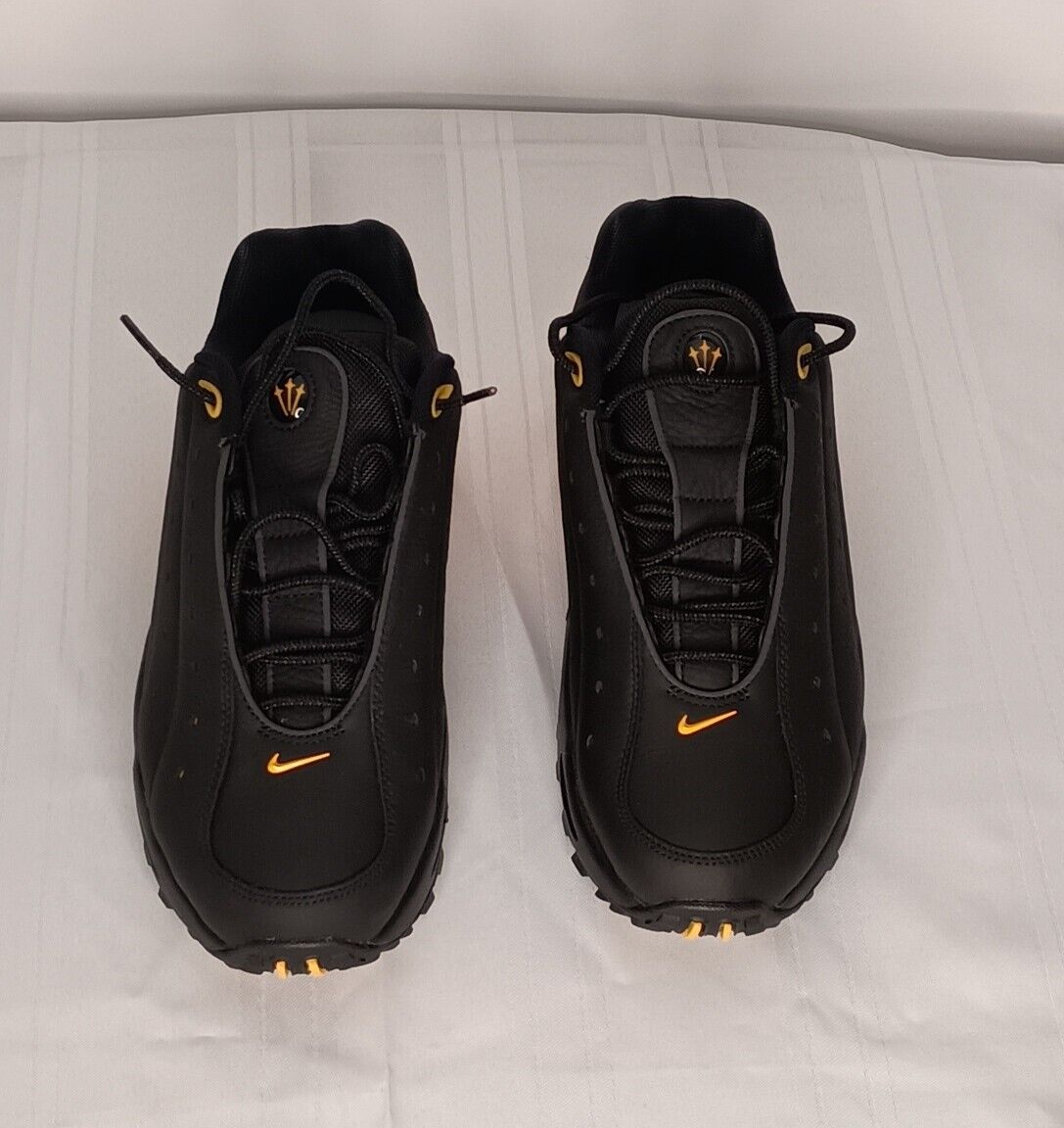 Nocta x Nike Hot Step Air Terra Black University Gold DH4692