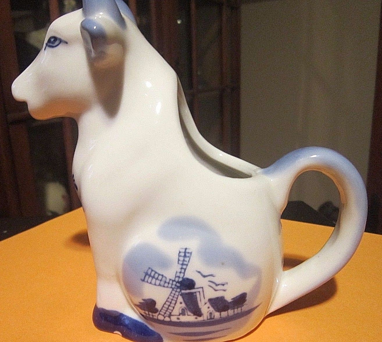 Cobalt Blue and White Windmill Sitting Cow Creamer