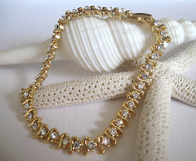 BMNY Gold Tone Clear Crystal S Shaped Links Tennis Bracelet Fold