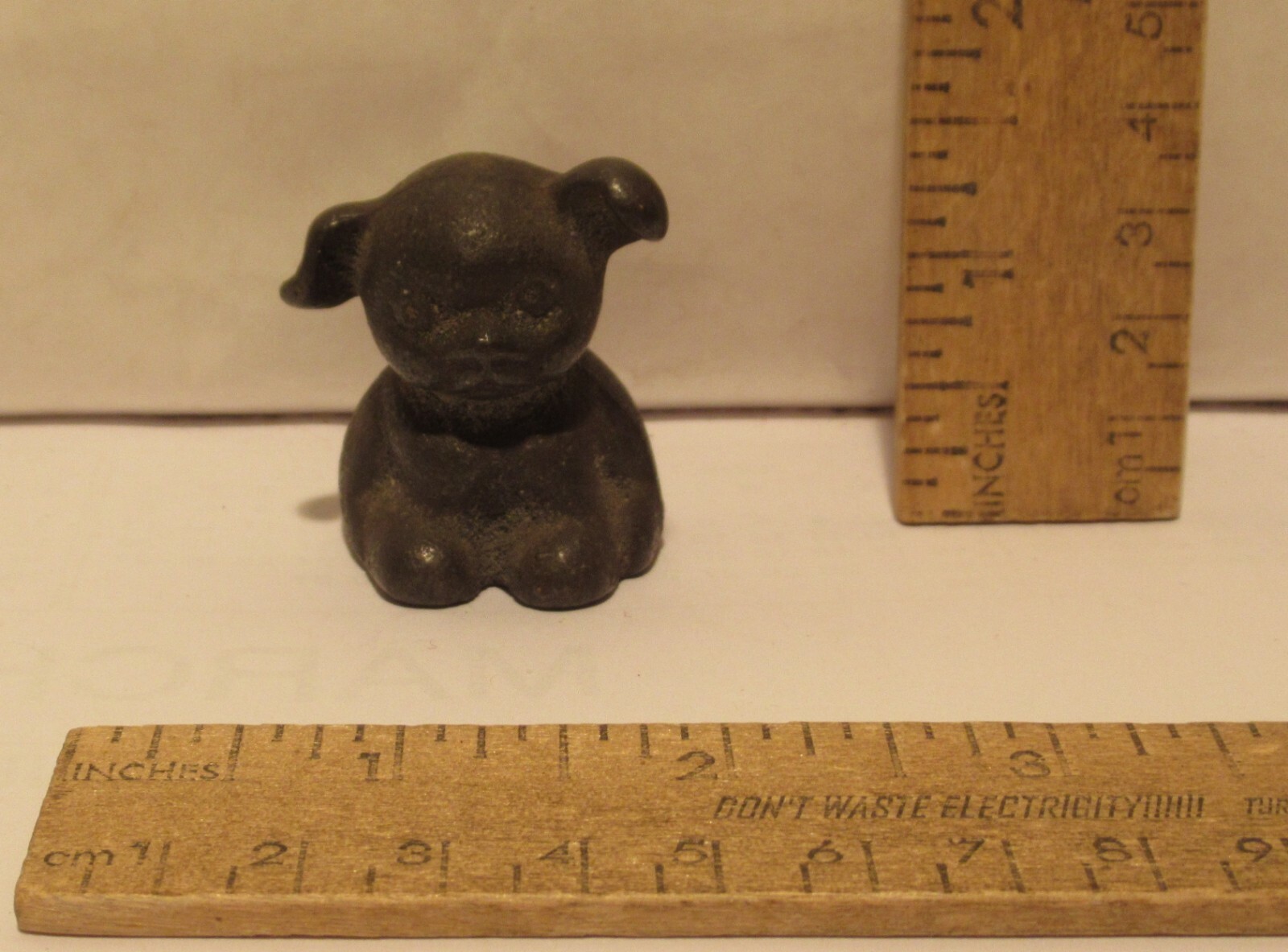 BUCKI CARBONS RIBBONS - Puppy Paperweight - Cast Iron Figure