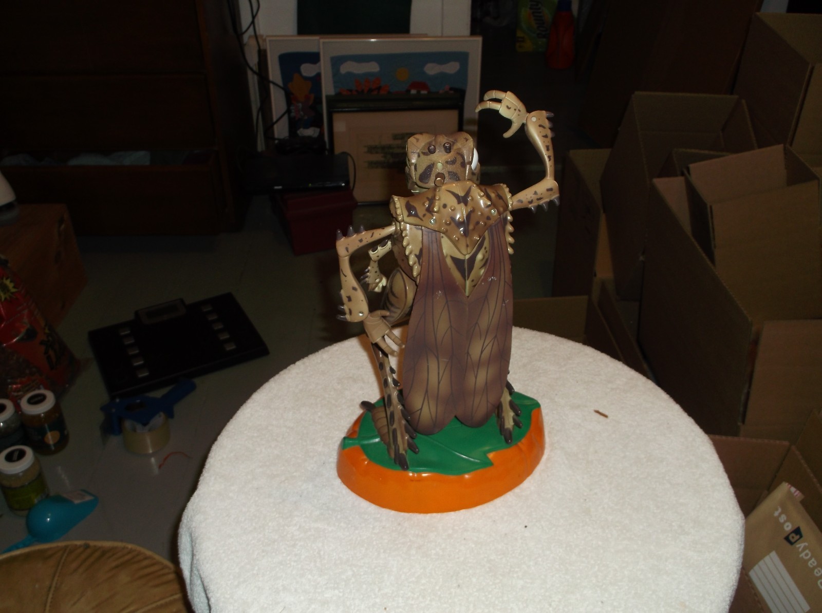 a 12 inch bug with wings that talks and is green