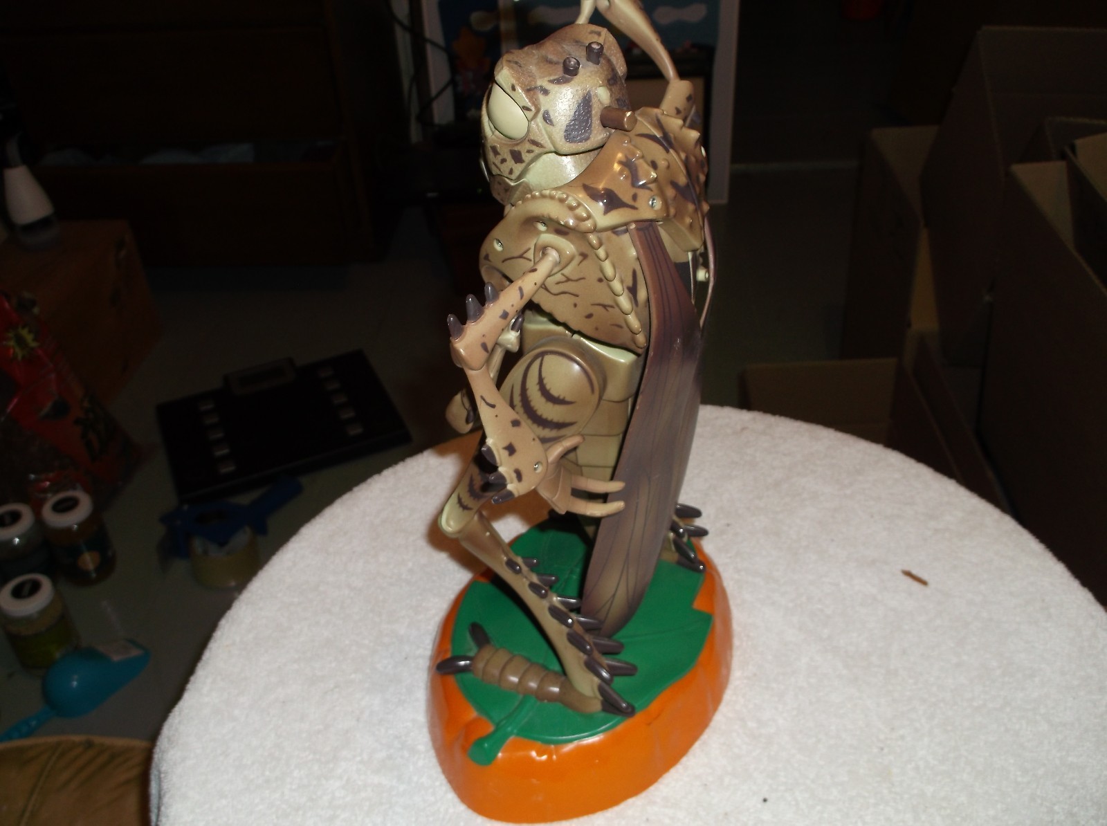 a 12 inch bug with wings that talks and is green