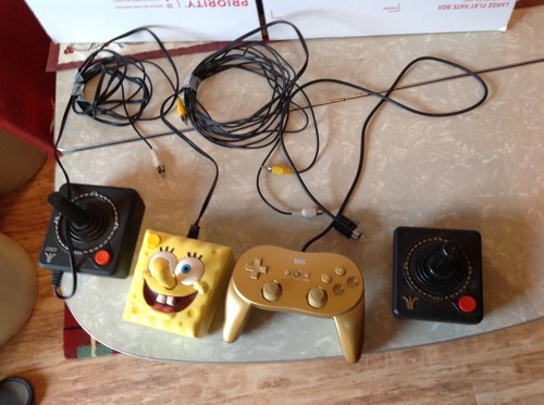 LOT OF 4 GAME CONTROLERS