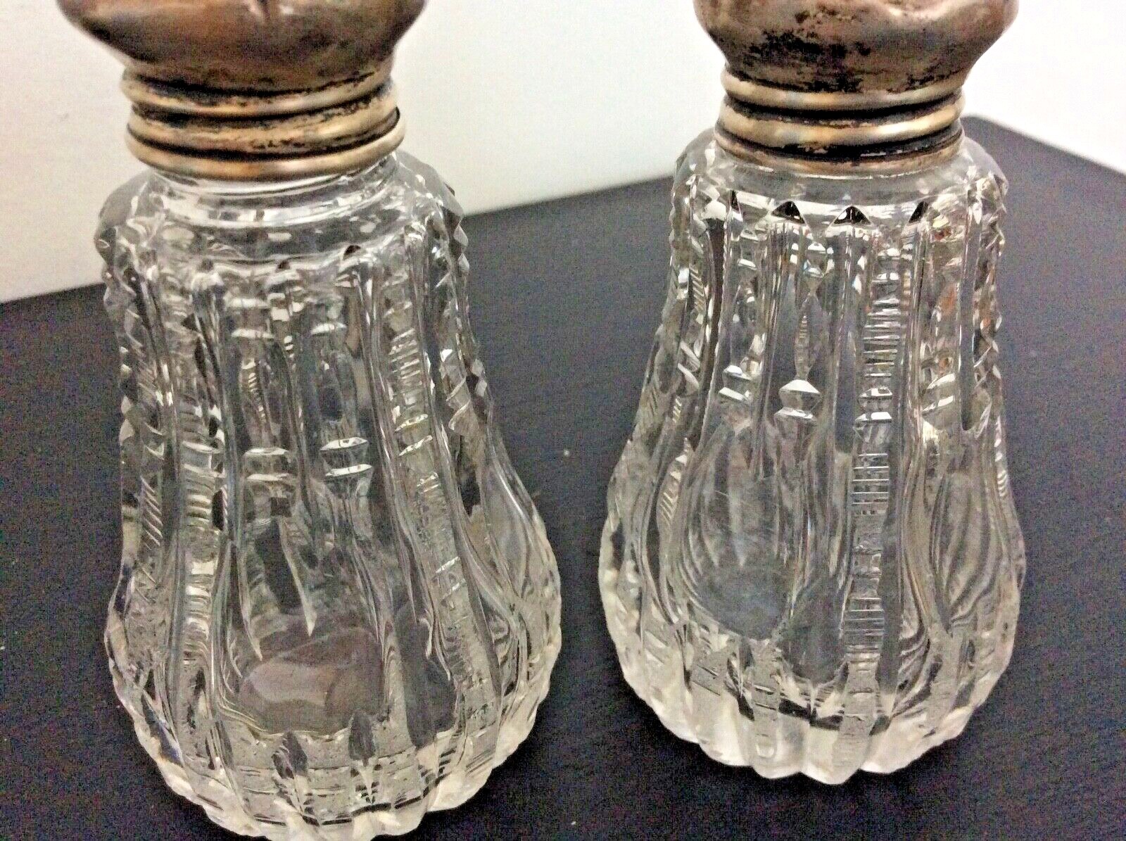 Antique crystal salt and pepper shakers, zipper cut silver lids