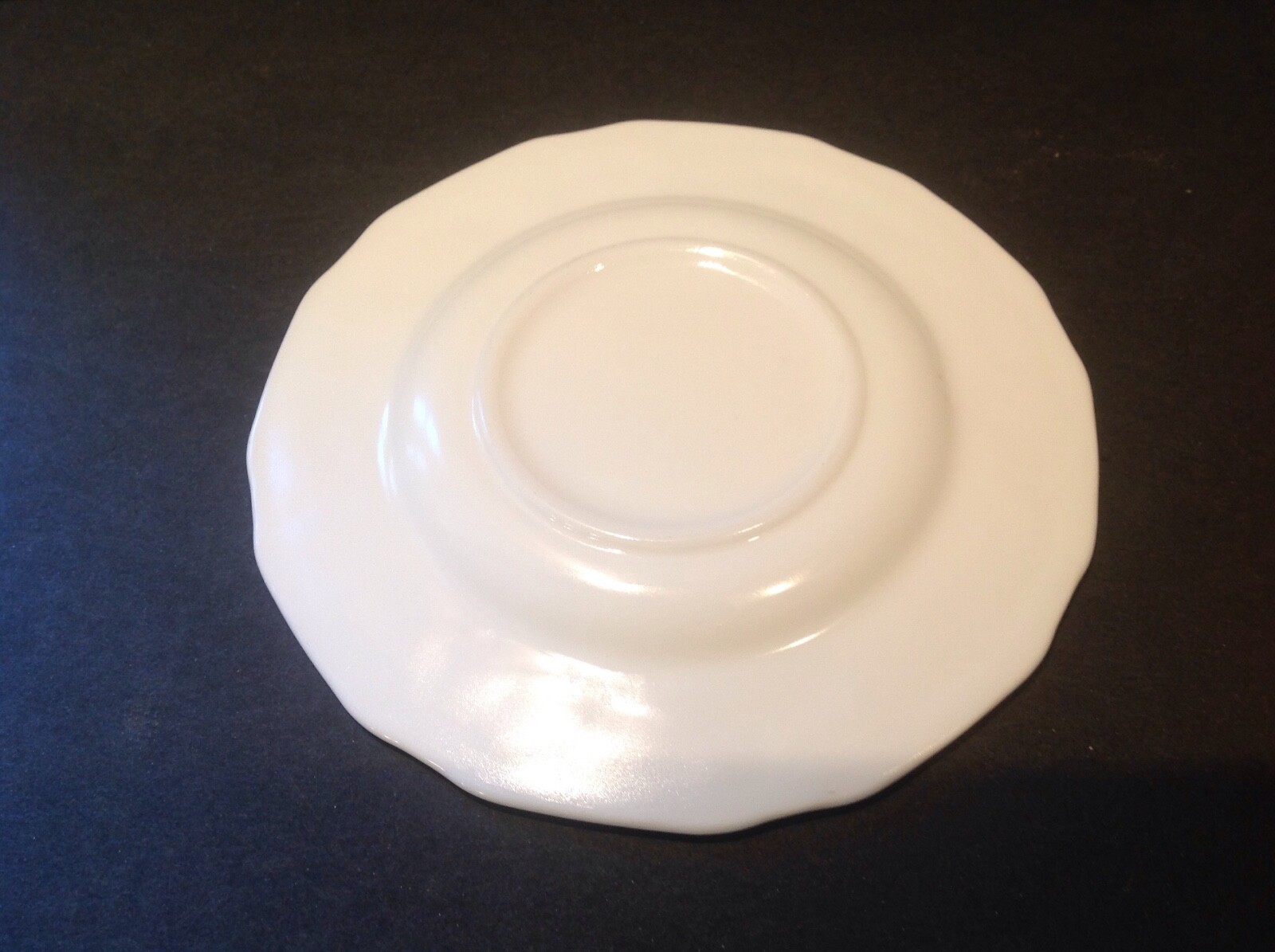 Two vintage milk glass saucers grape design.