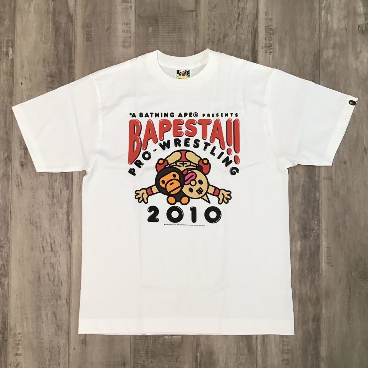 A BATHING APE - APE プロレスドッキングTシャツ BAPE × Kinnikuman BAPE STA PRO WRESTLING Milo T-shirt White