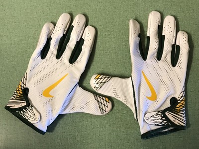 white and yellow football gloves