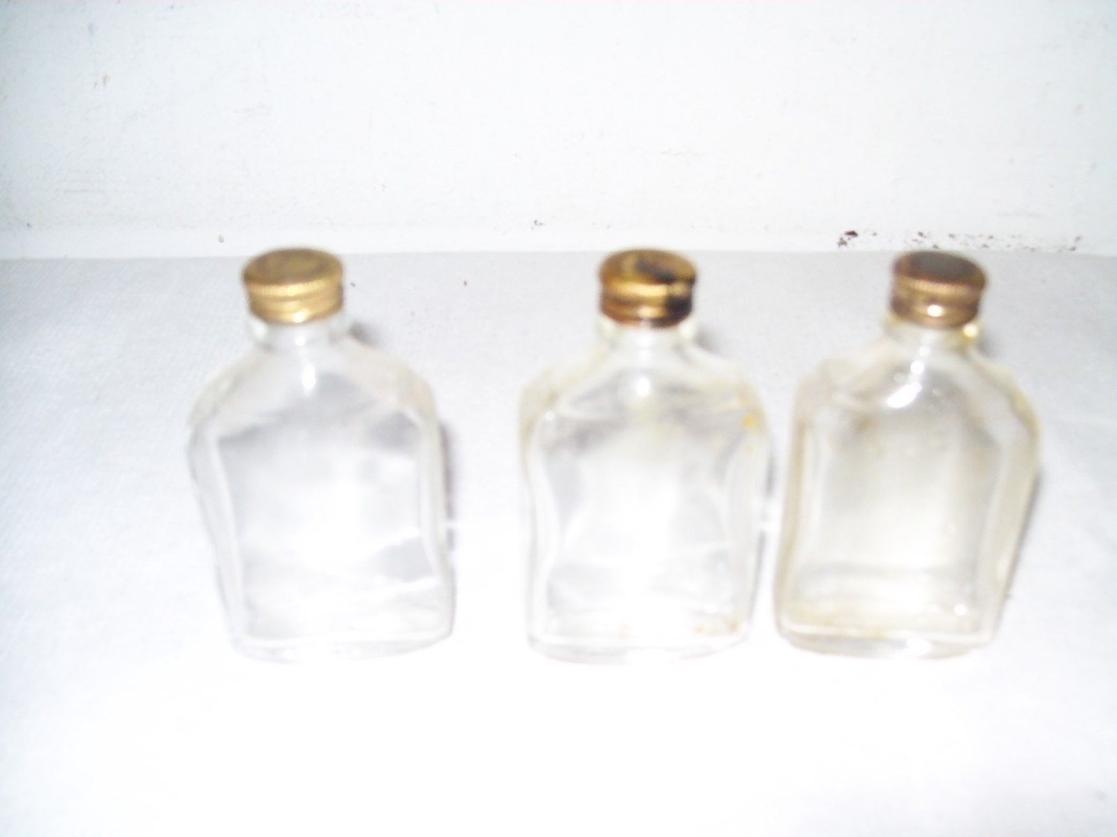 Lot of 13  vintage pharmacy  medicine bottles with brass caps ,early 1900's