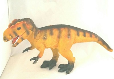 yellow dinosaur toy